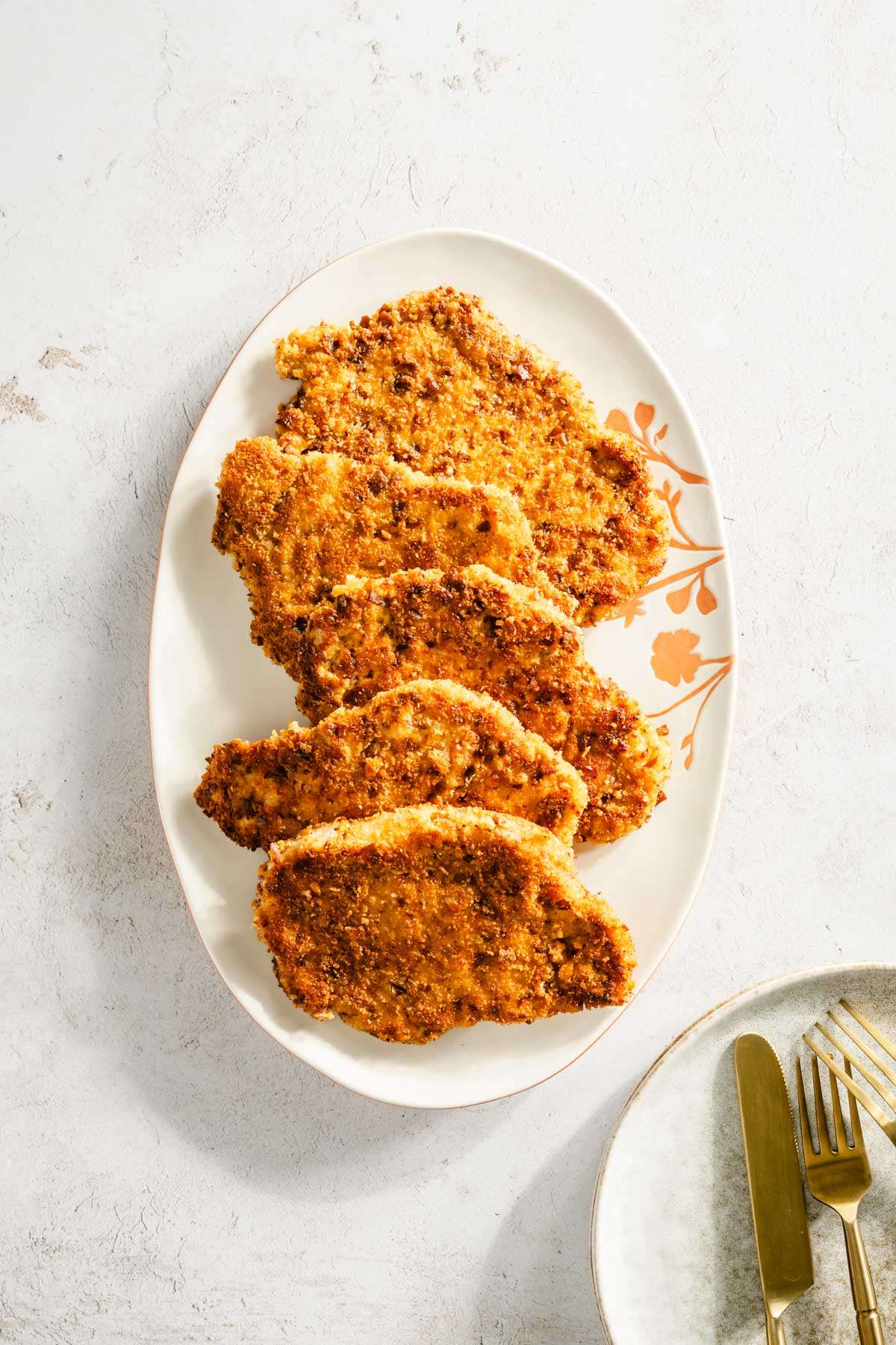 cooked pork chops on a serving plate