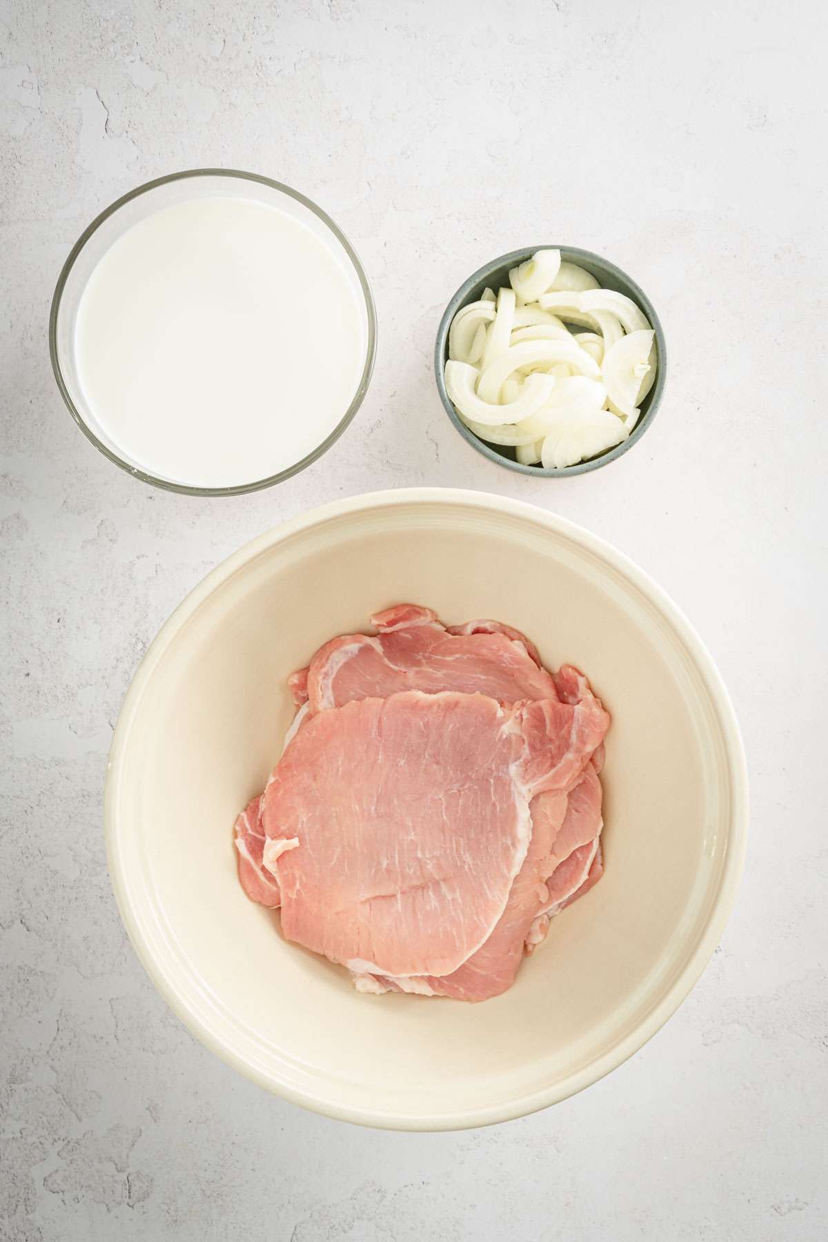 pork chops ina large bowl, ready for marinade