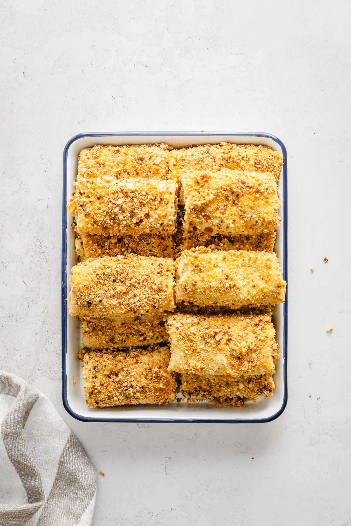 breaded krokiety arranged on a baking tray