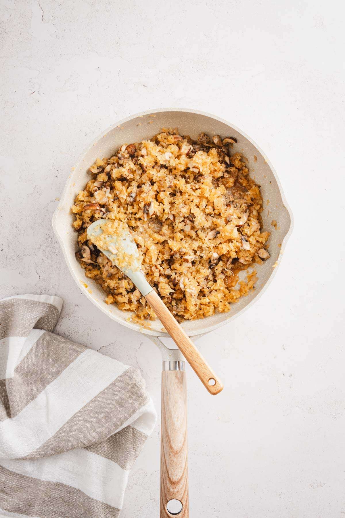 skillet with cooked mushrooms and kraut mixed together