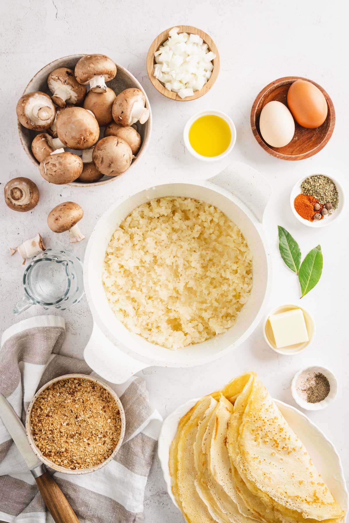 pan with raw kraut. Other ingredients to make Krokiety arranged around