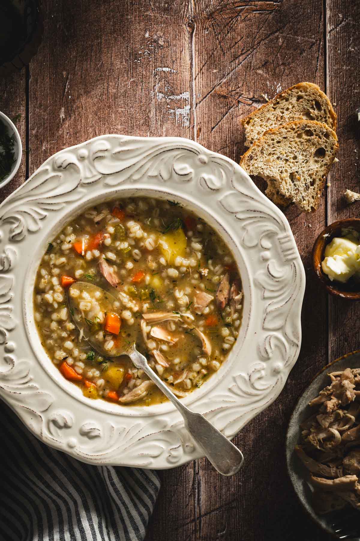 Krupnik in a serving bowls, wooden background