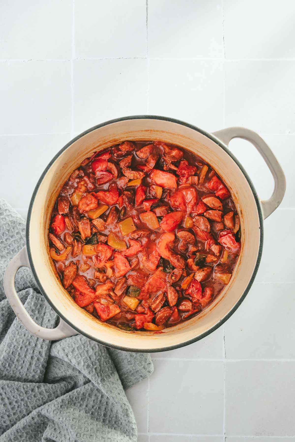 cooking por with some of the ingredients for leczo in it, added tomatoes sauce