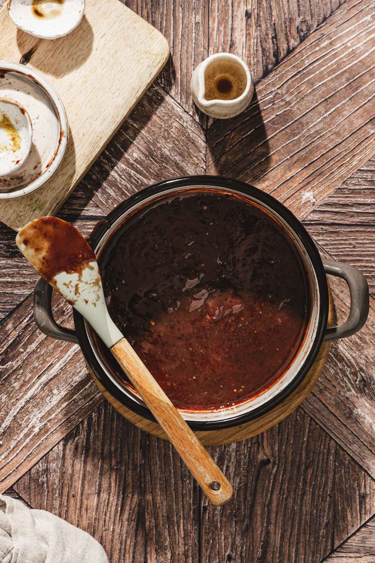 small sauce pan with plum glaze