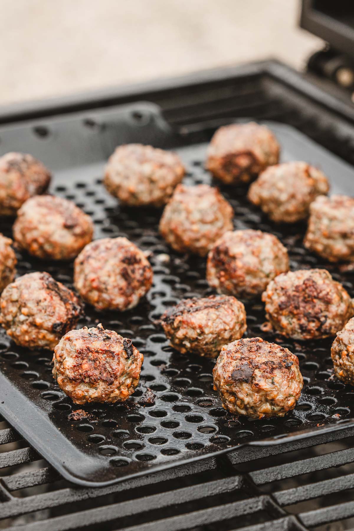 cooked meatballs on the grill grates