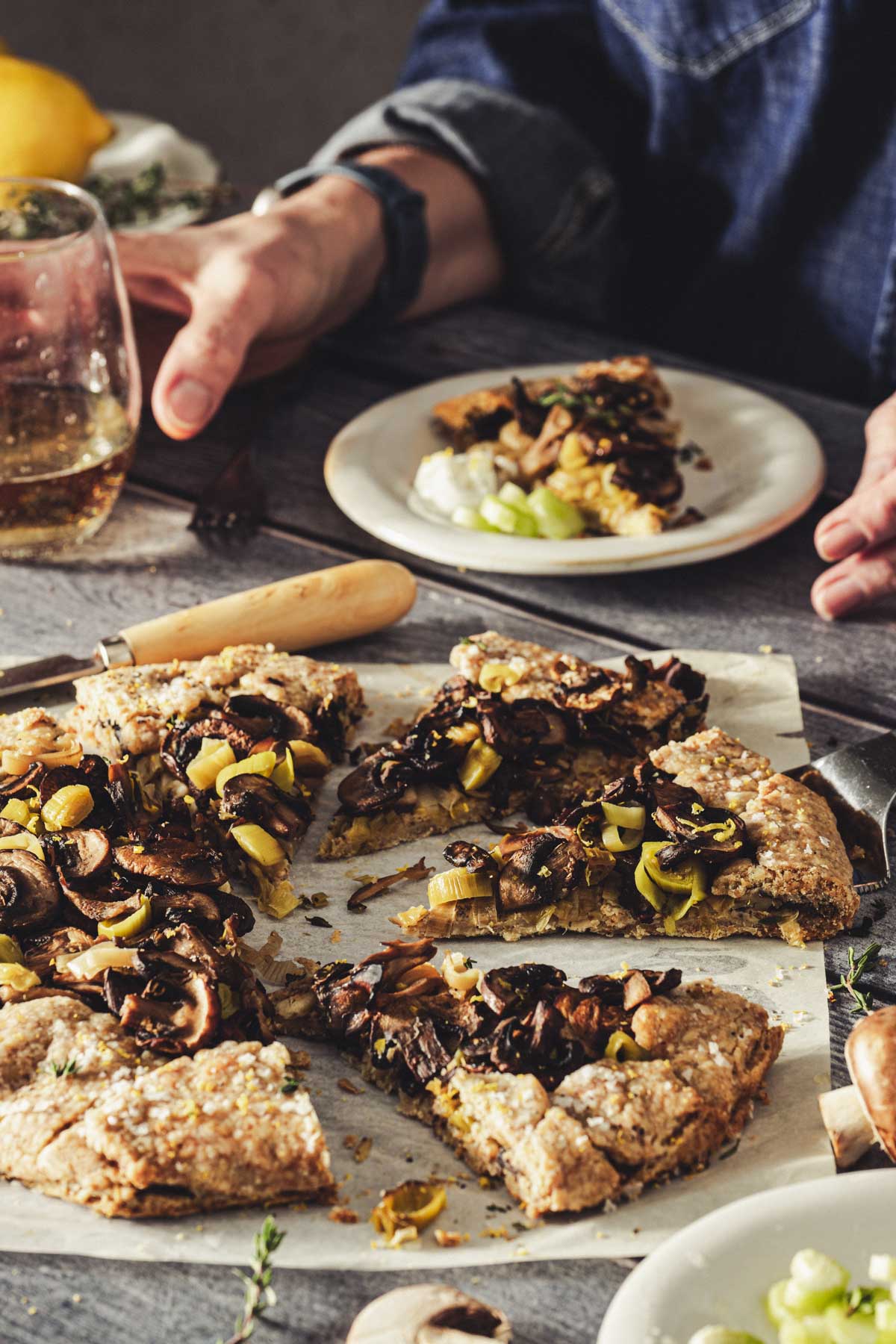 hands in frame hilding glass with wine