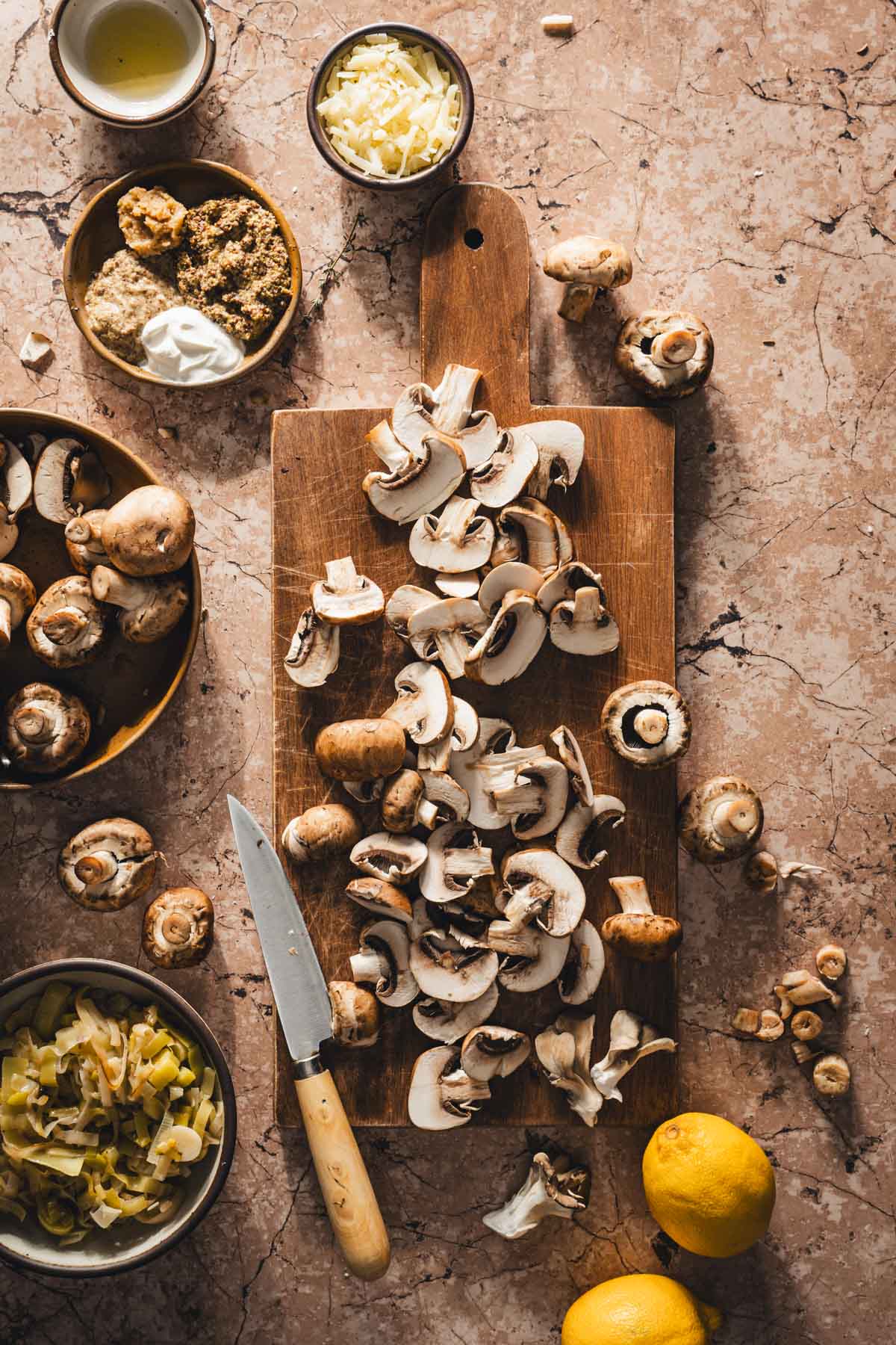 sliced mushrooms on a wodden cutting board