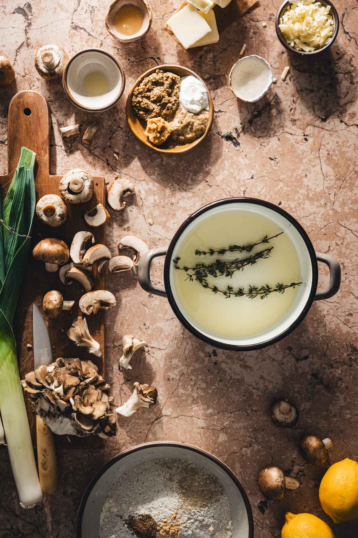 small sauce pan with olive oil and thyme springs