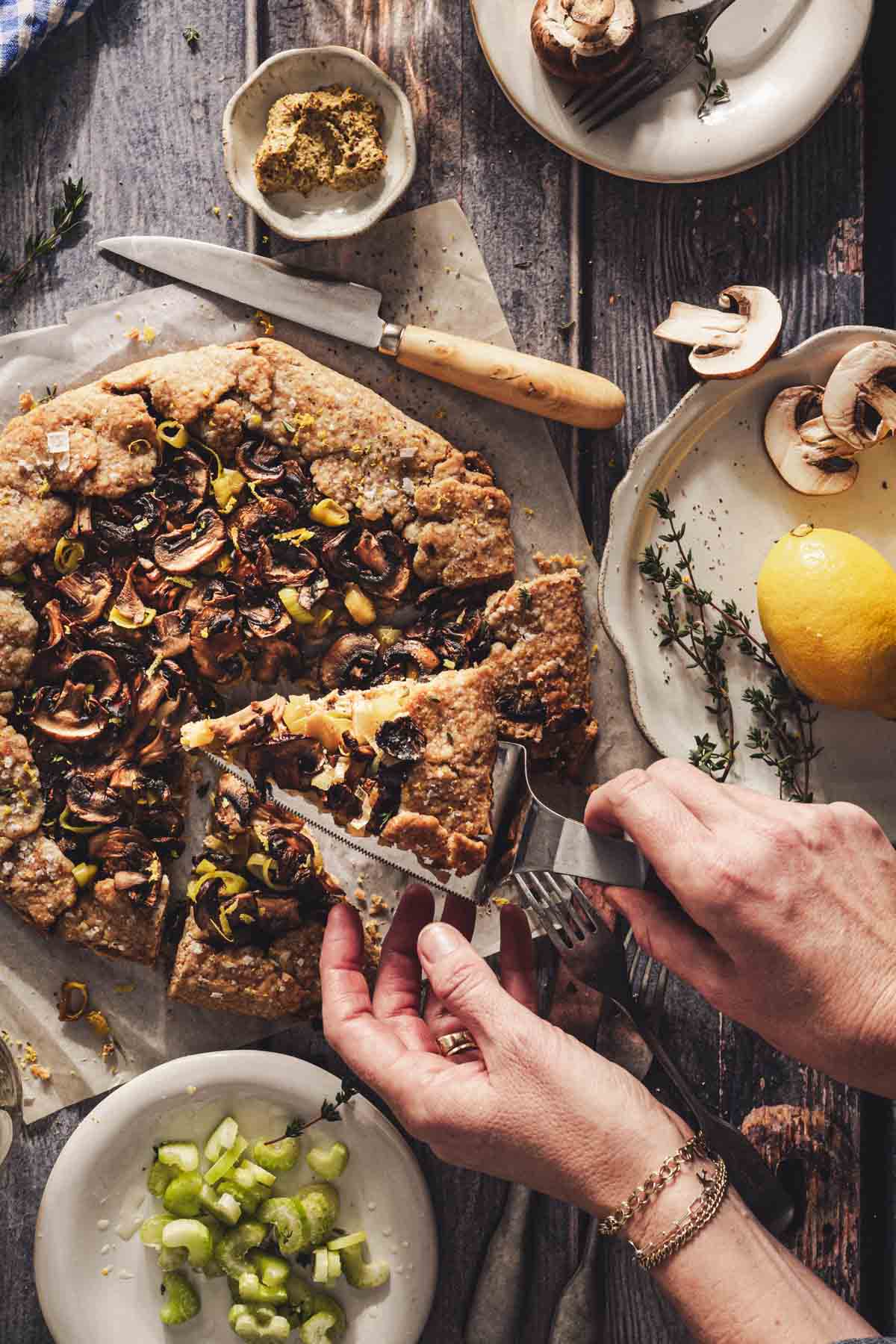 hands in frame holding serving of a galette