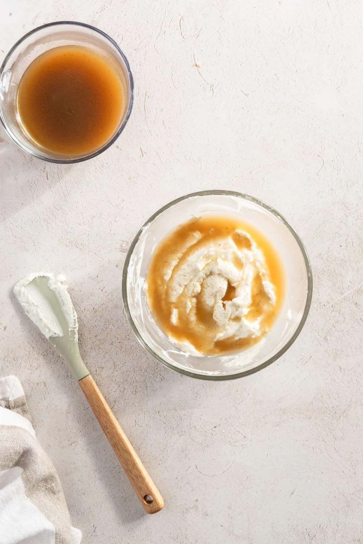 bowl with sour cream and some of the mushroom water; bowl with mushroom water, spatula