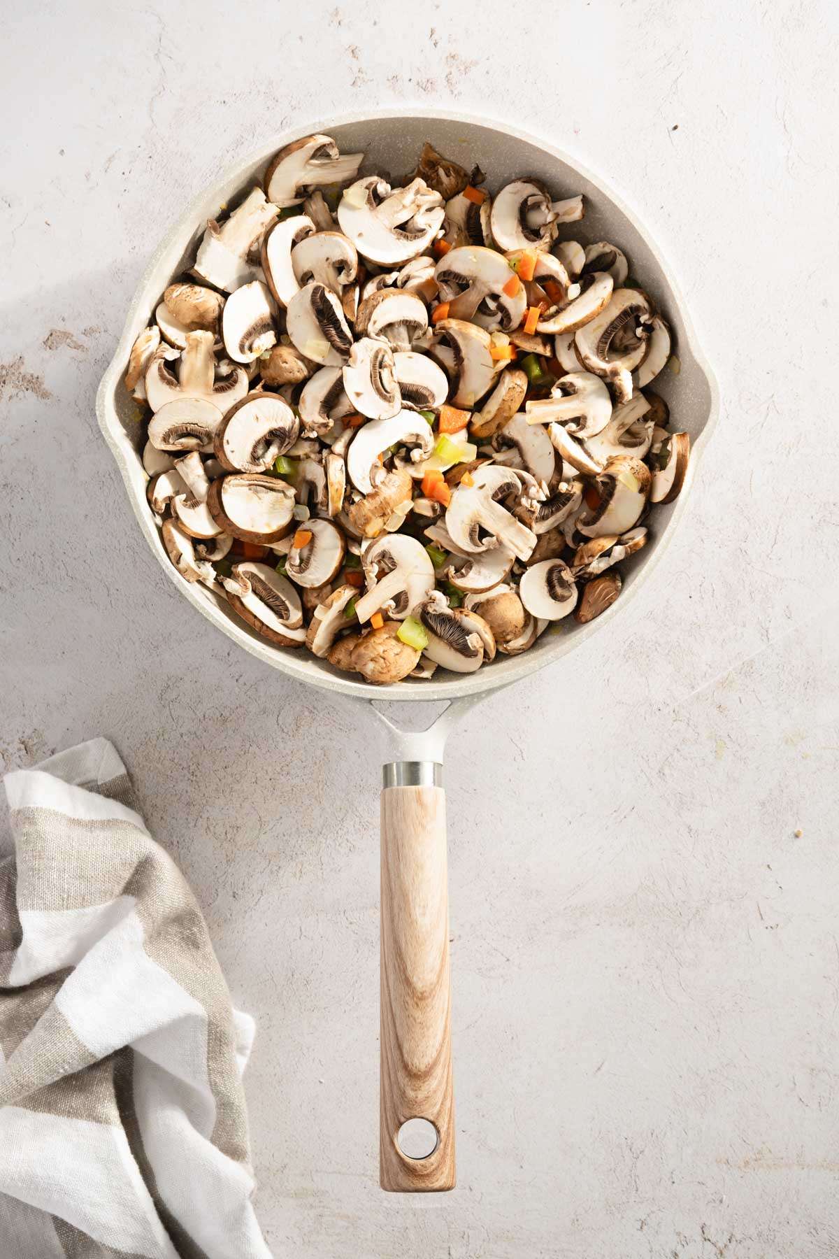 frying pan with mushrooms and veggies