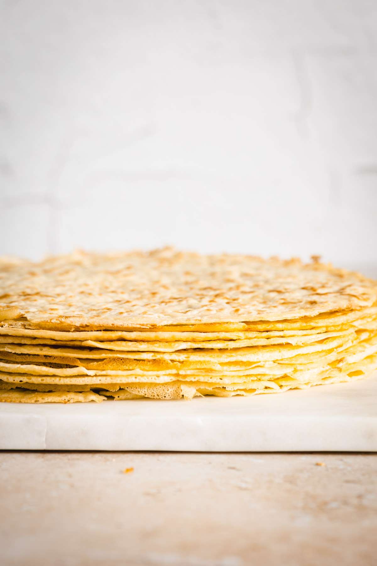 stack of nalesniki on a plate, front view