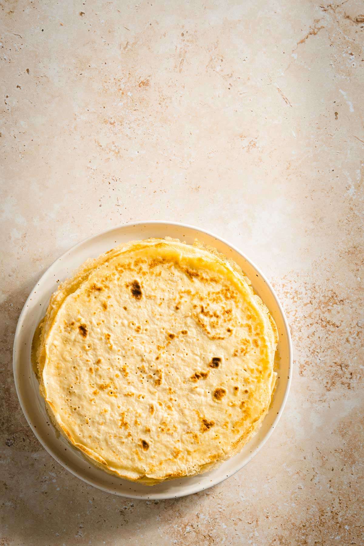 stack of nalesniki on a plate, top view