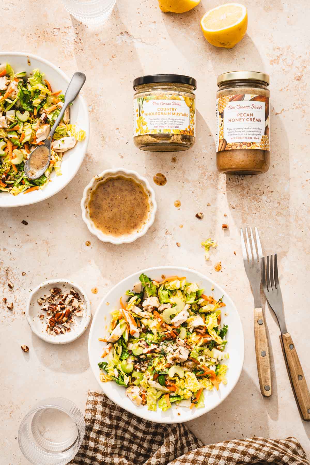 brand jars, serving bowls with salad, dish with dressing