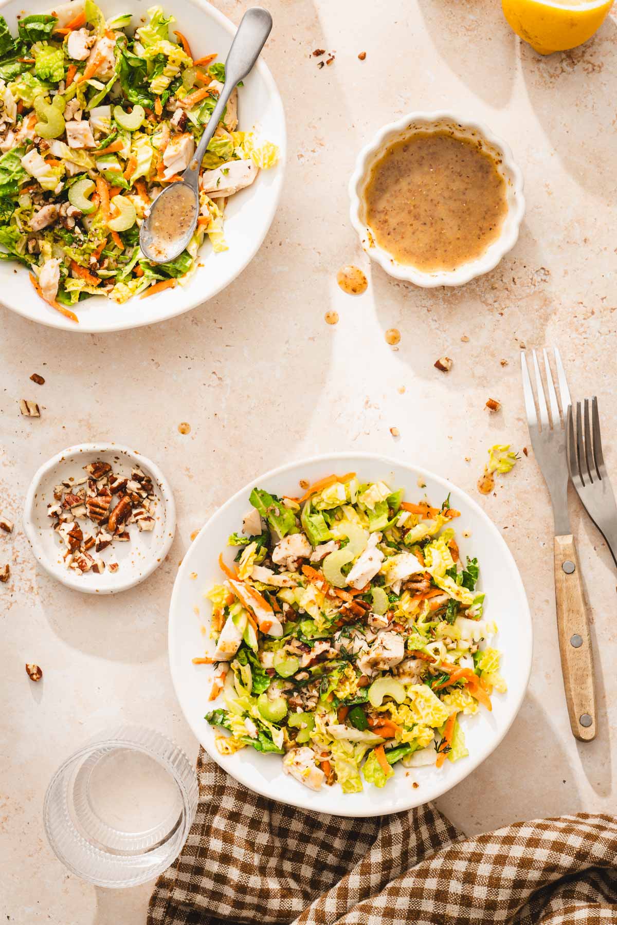 serving bowls with napa salad, forks, napki