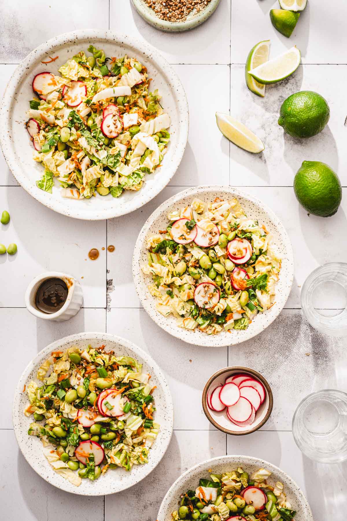 various bowls with the napa cabbage salad