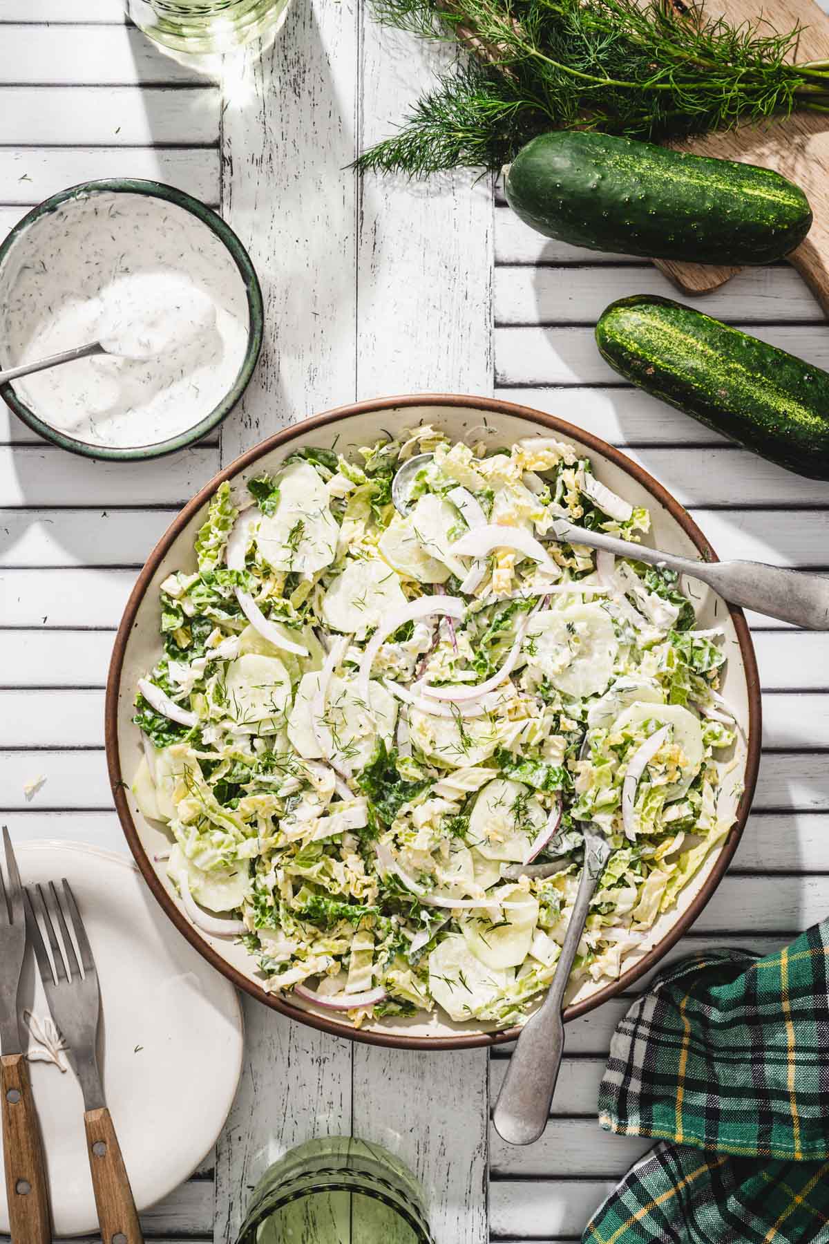 serving bowl with napa mizeria, dish with creamy dressing