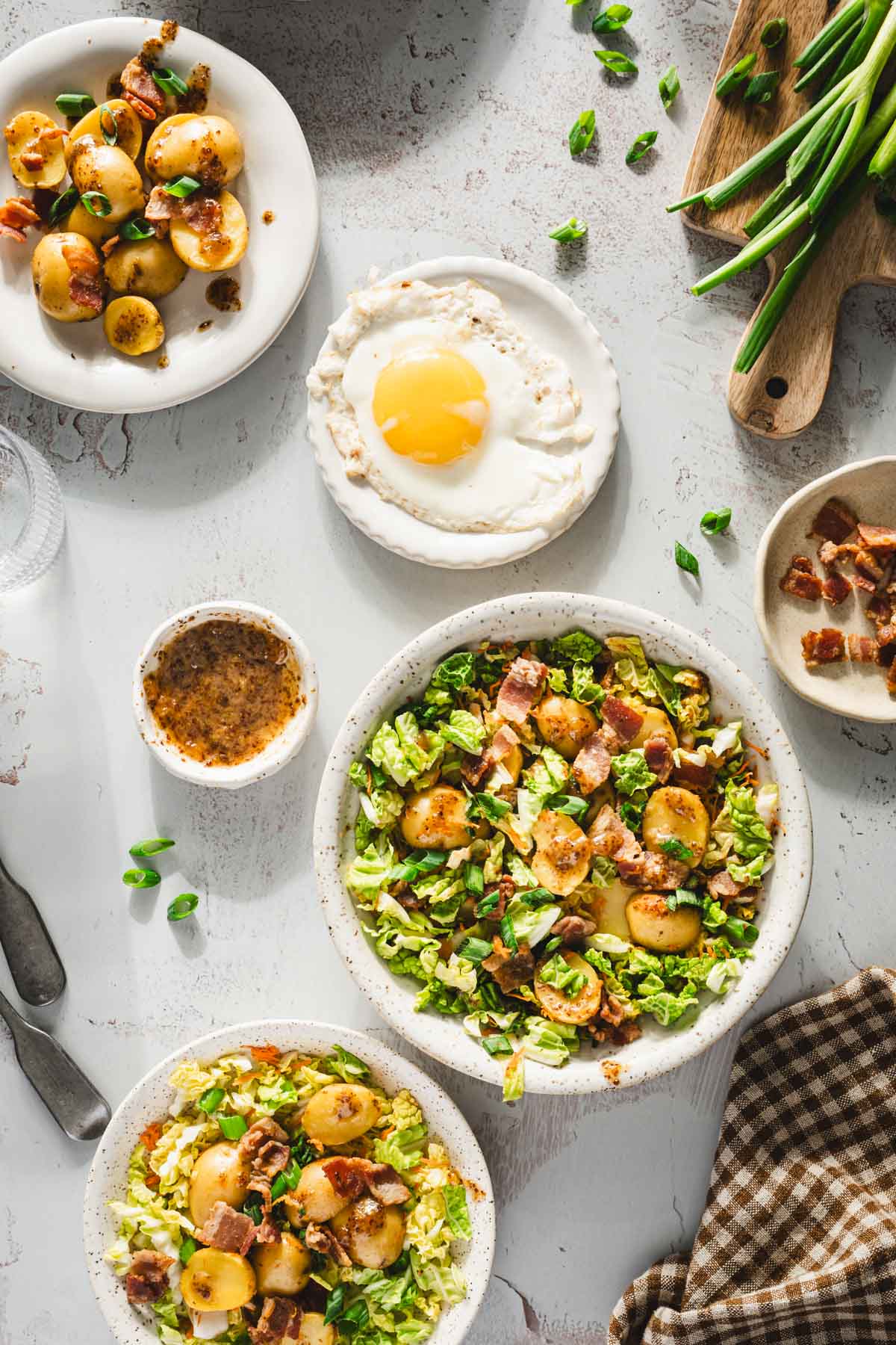 various plates and serving bowls with napasalad