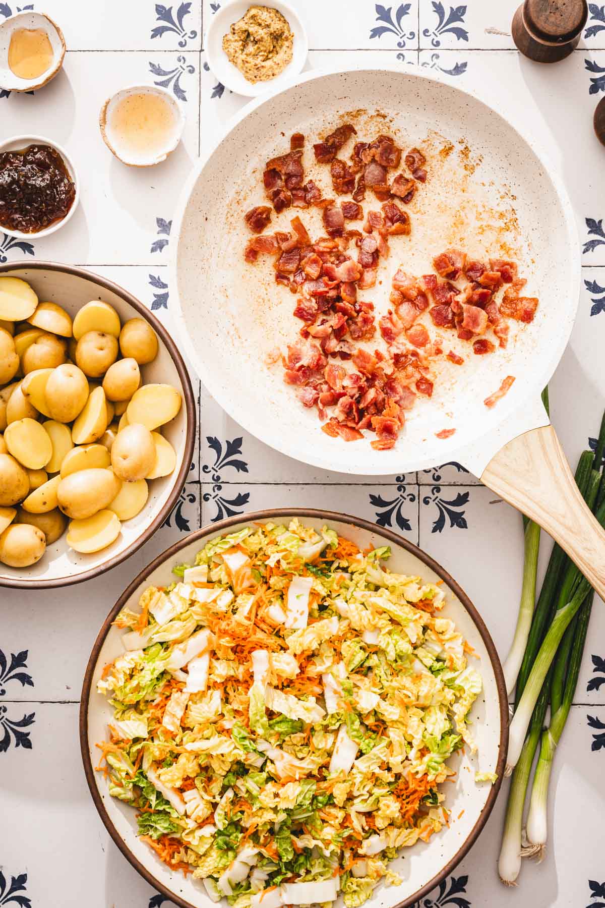skillet with cooked bacon, other ing in bowls