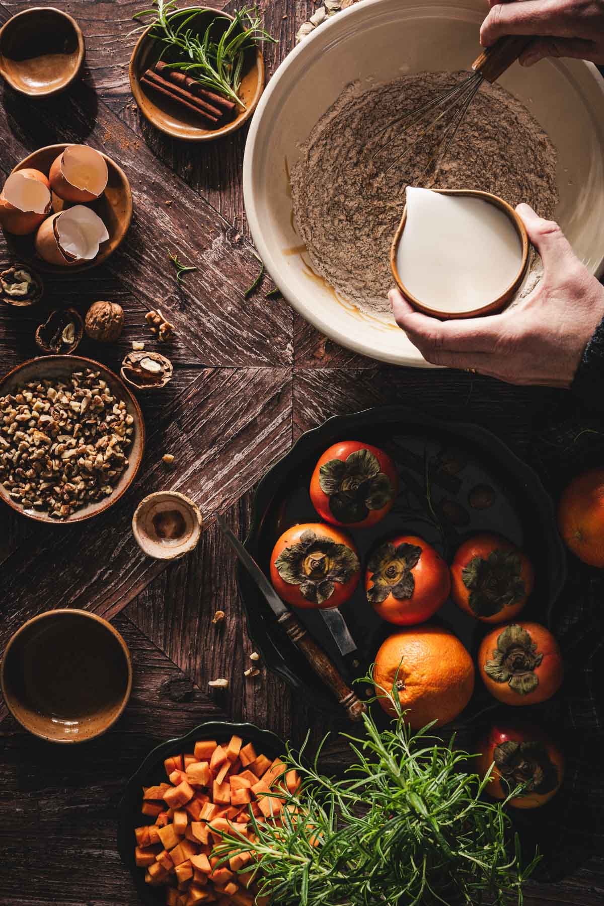 hands in frame adding milk tothe batter