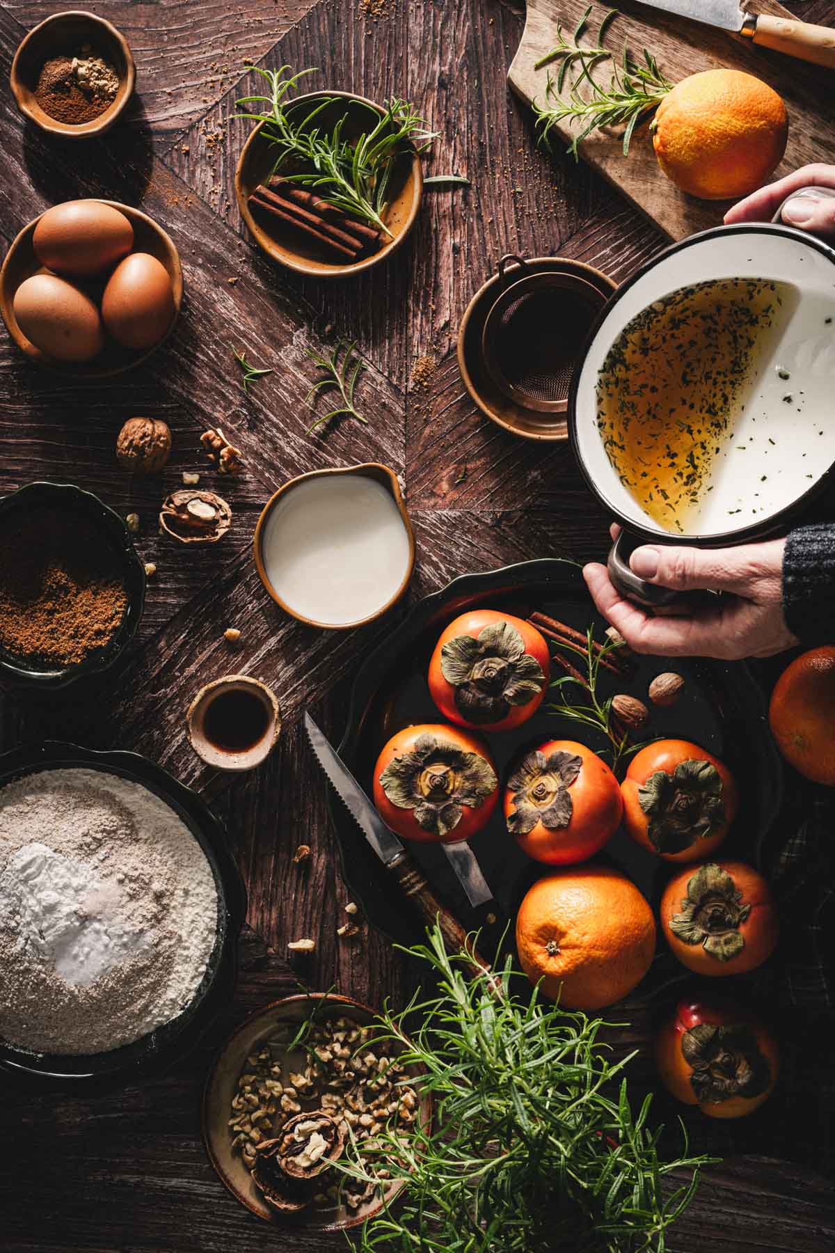 hands in frame holding pan with infused olive oil