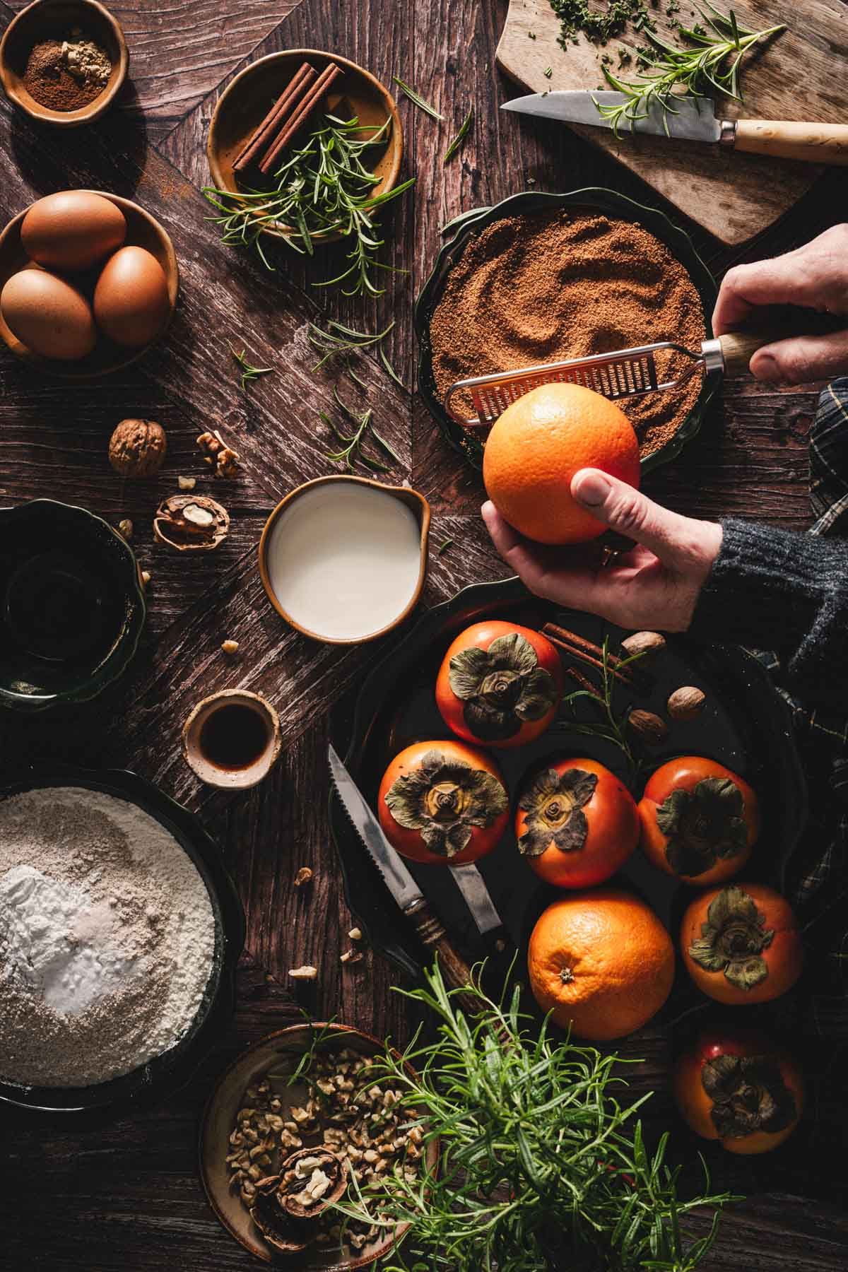 hands in frame zesting anorange