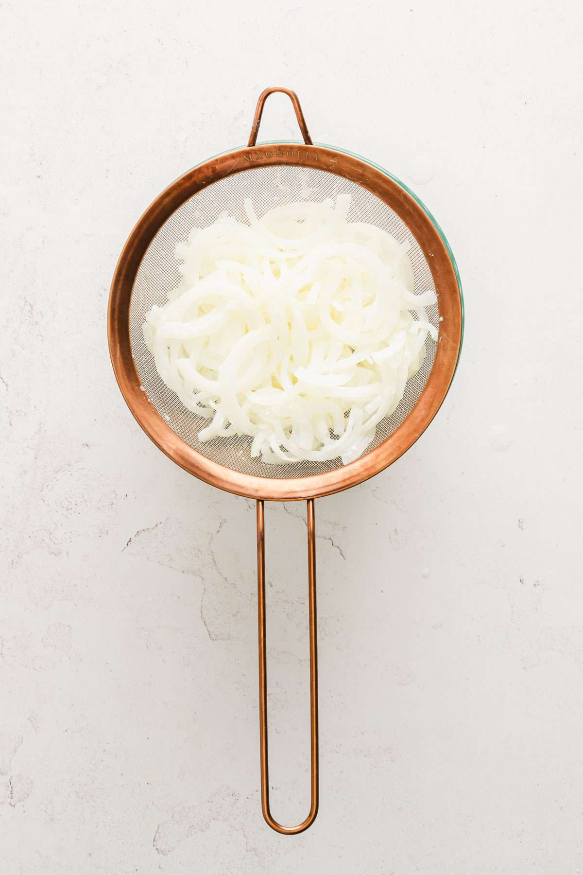 onions draining in the sieve