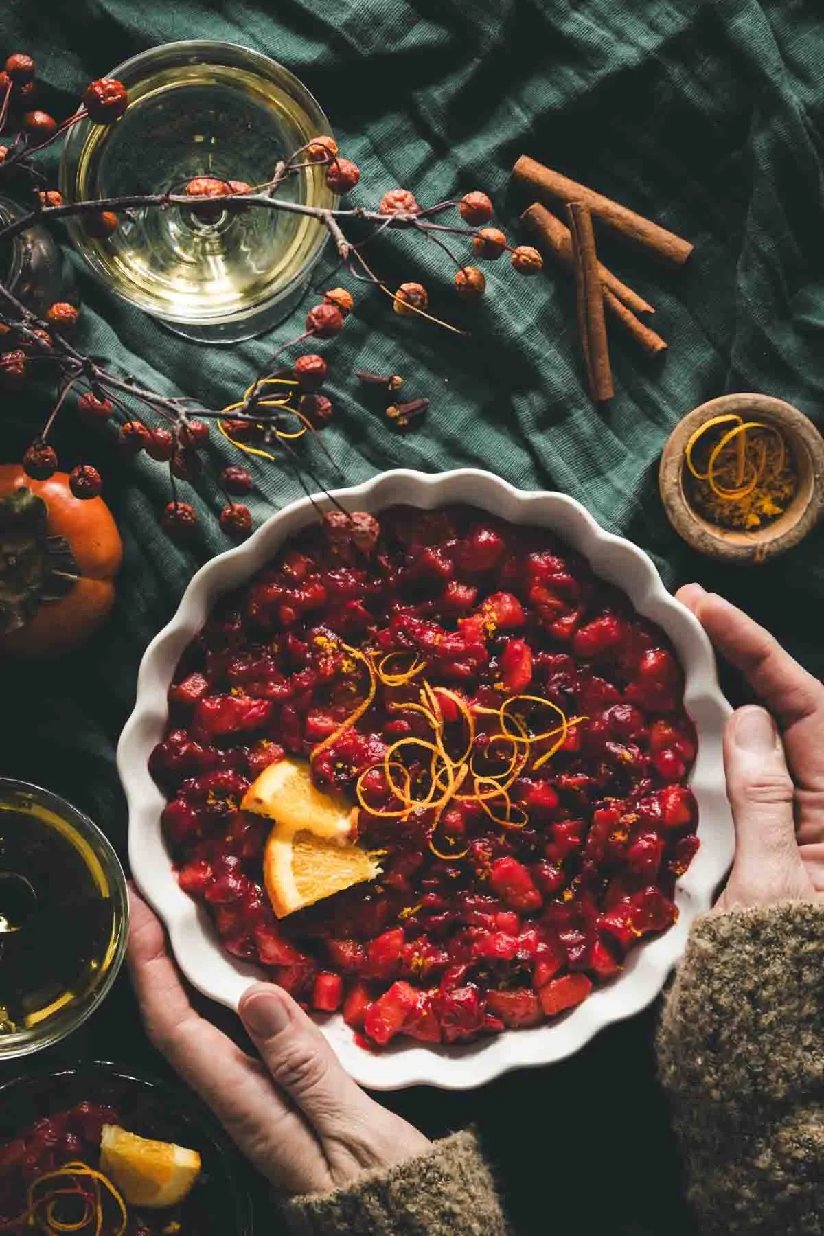 PERSIMMON CRANBERRY SAUCE IN A WHITE BOWL ON GREEN BACKGROUND