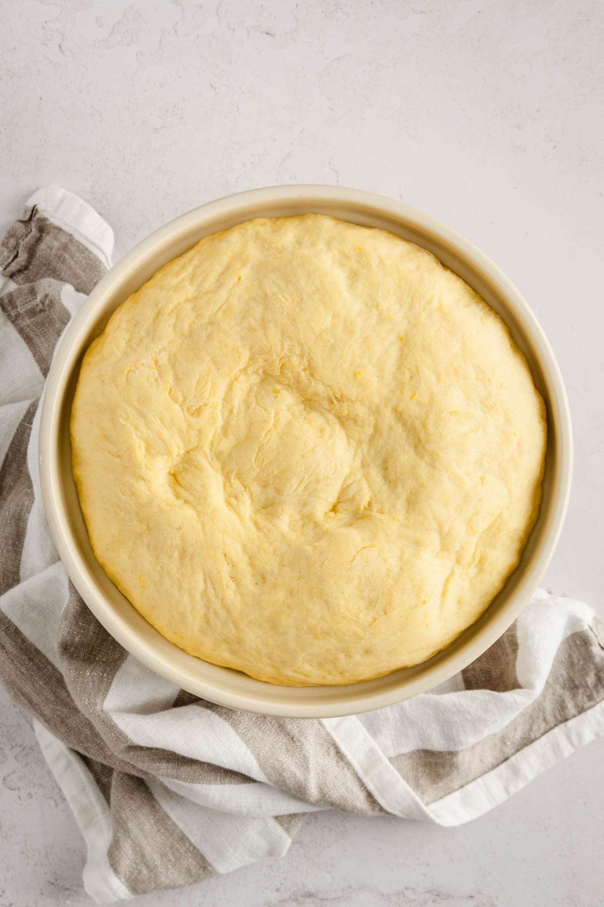 paczki dough in a bowl, doubled in size