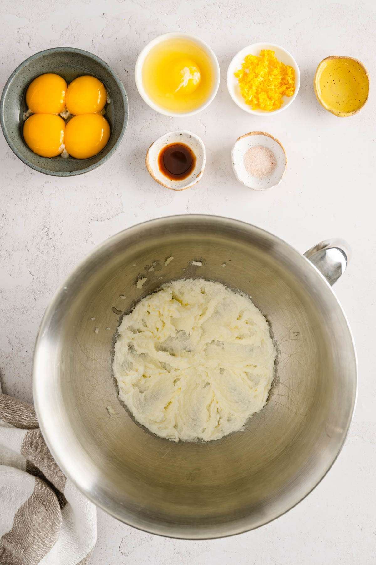 bowl with whipped sugar with egg, rest of the ingredients to make paczki