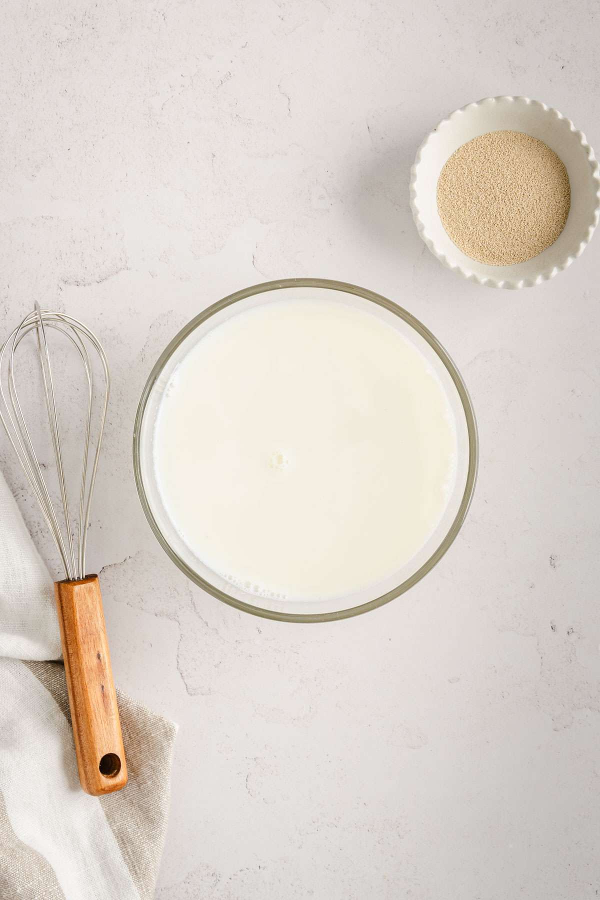 milk in a bowl, small dish with yeast