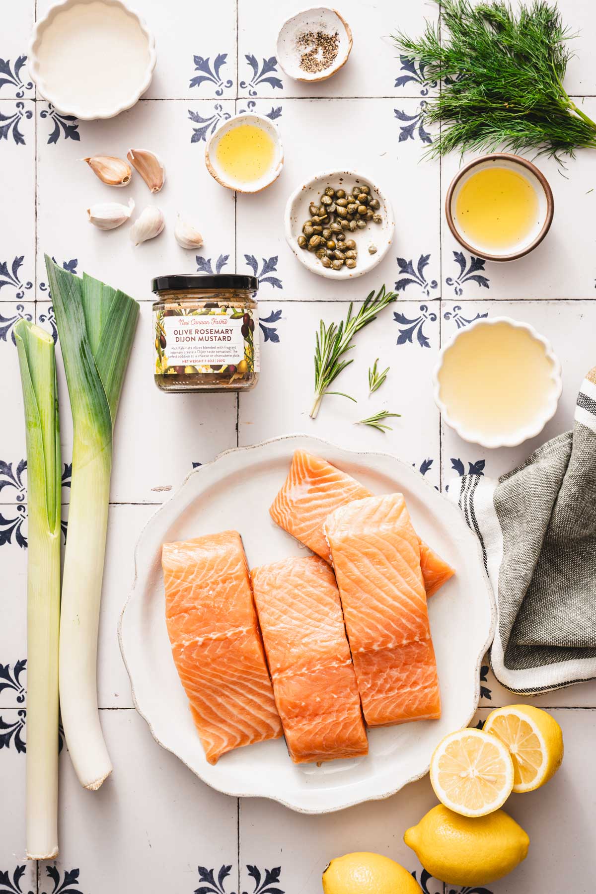 ingredients to amke Pan Sared salmon with a jar of Olive Rosemary Mustard