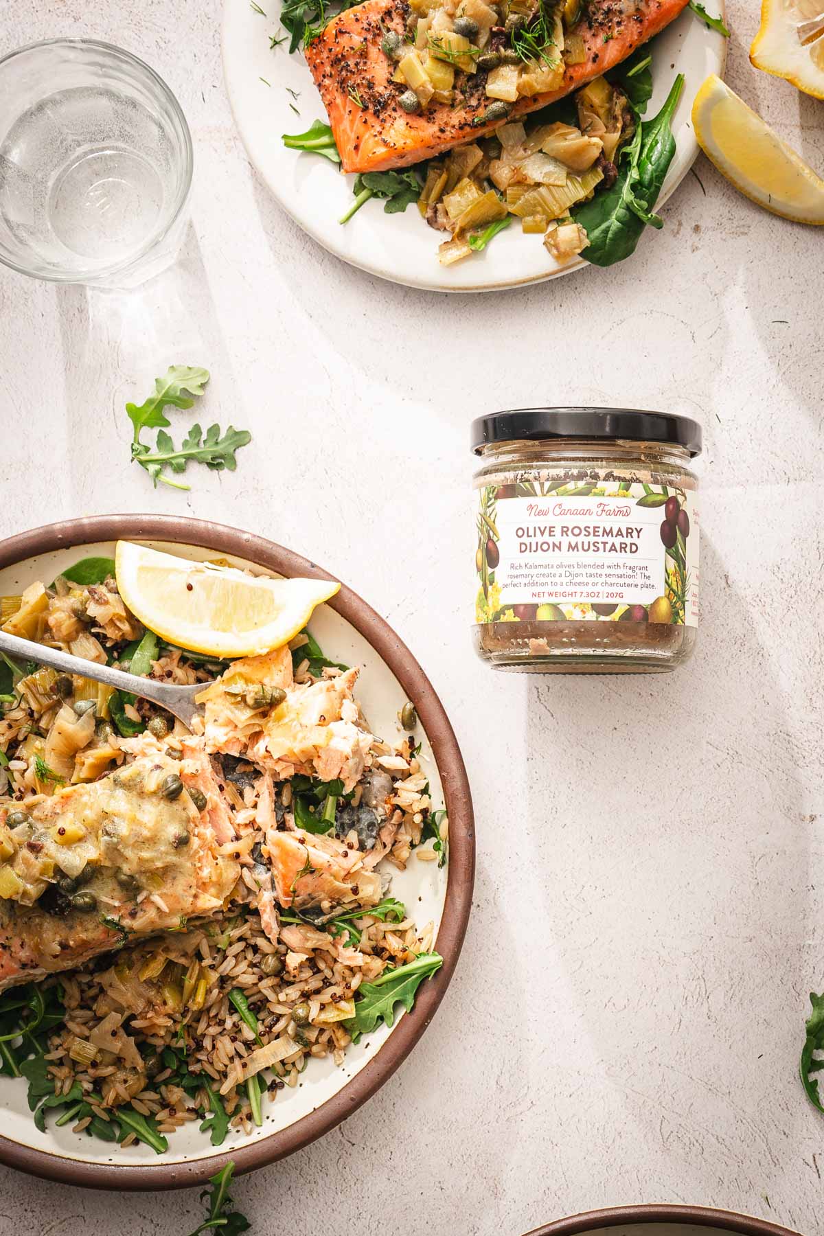 closeup of a plate and jar with mustard