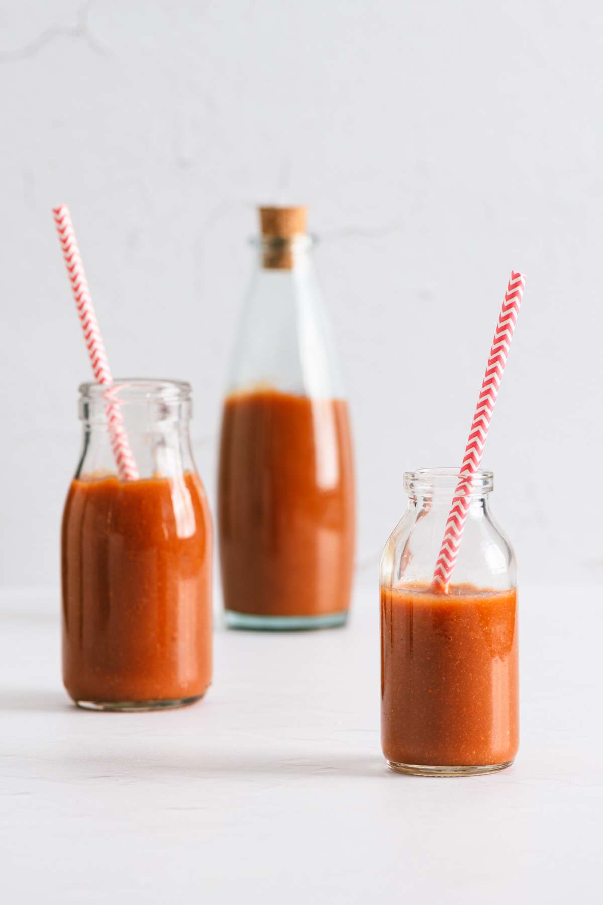 Peach BBQ Sauce in various bottles, straight on view