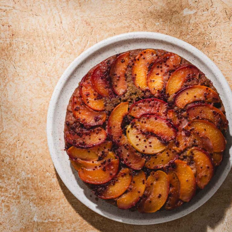 peach ud cake on a serving plate