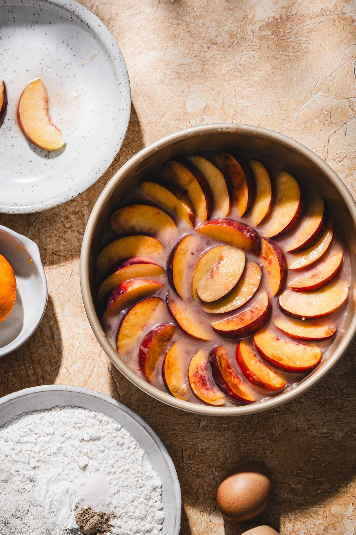 peach ud cake in a baking pan