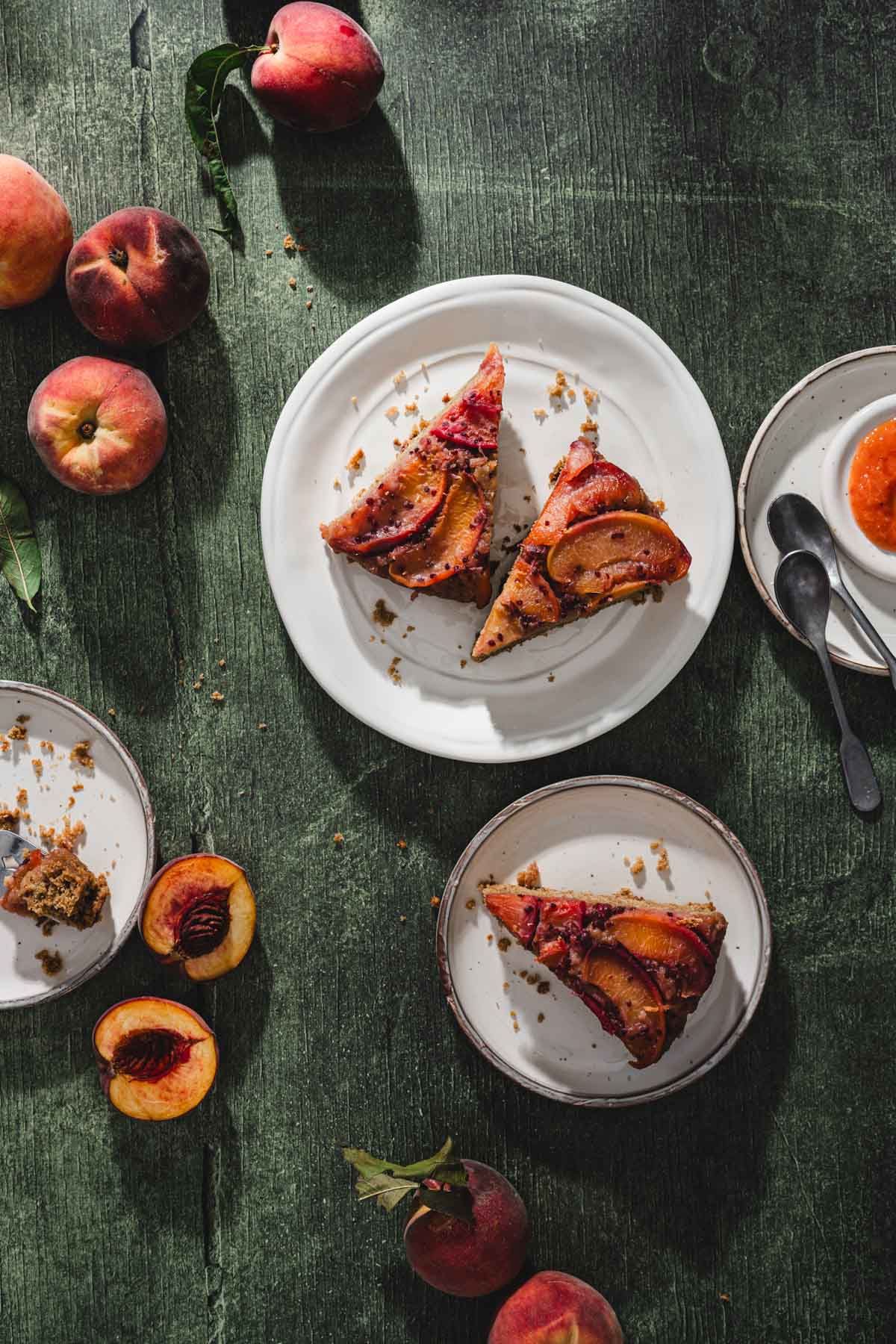 top view or peach cake on serving plates