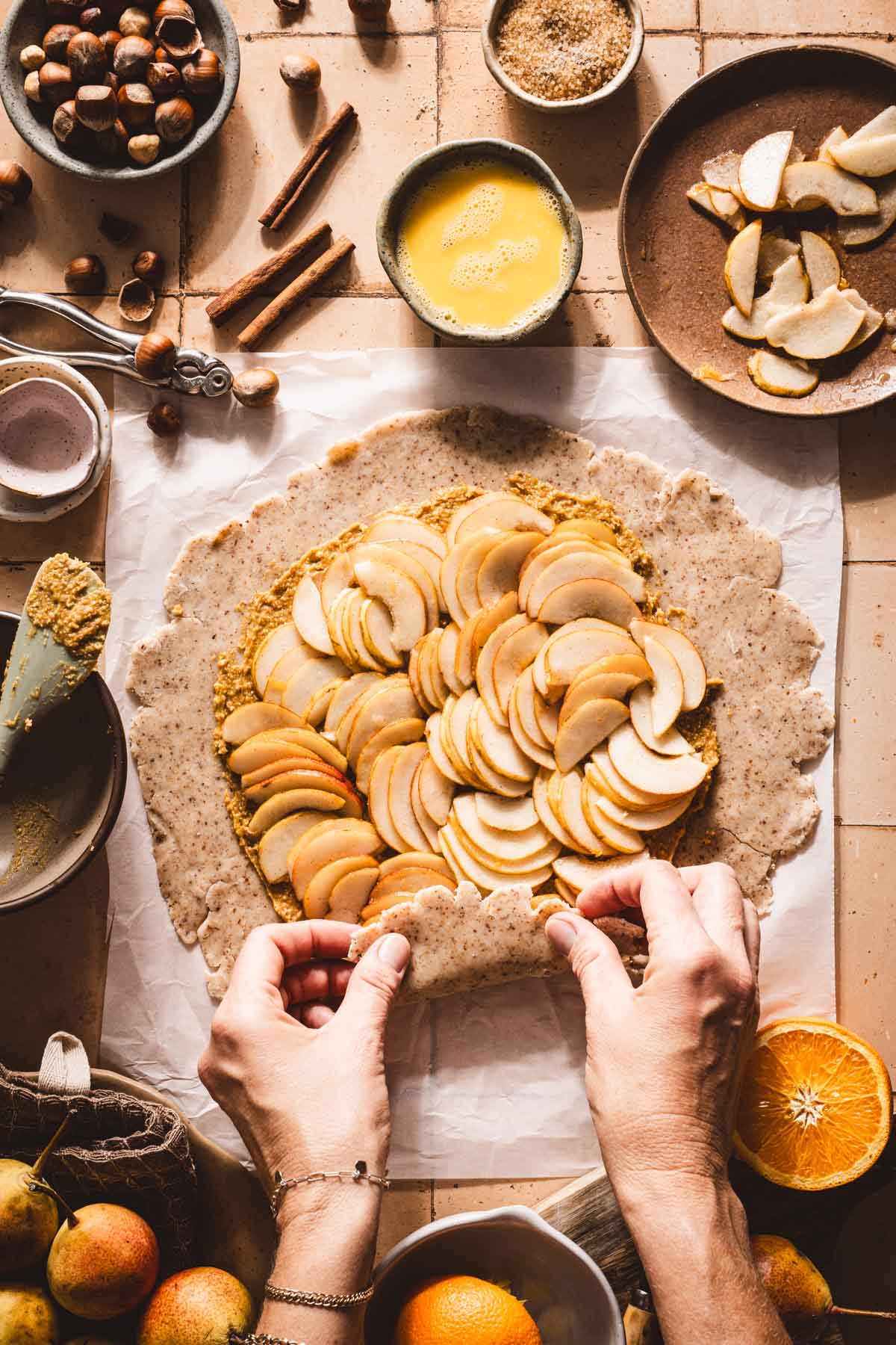 hands in frame folding the edges of the dough