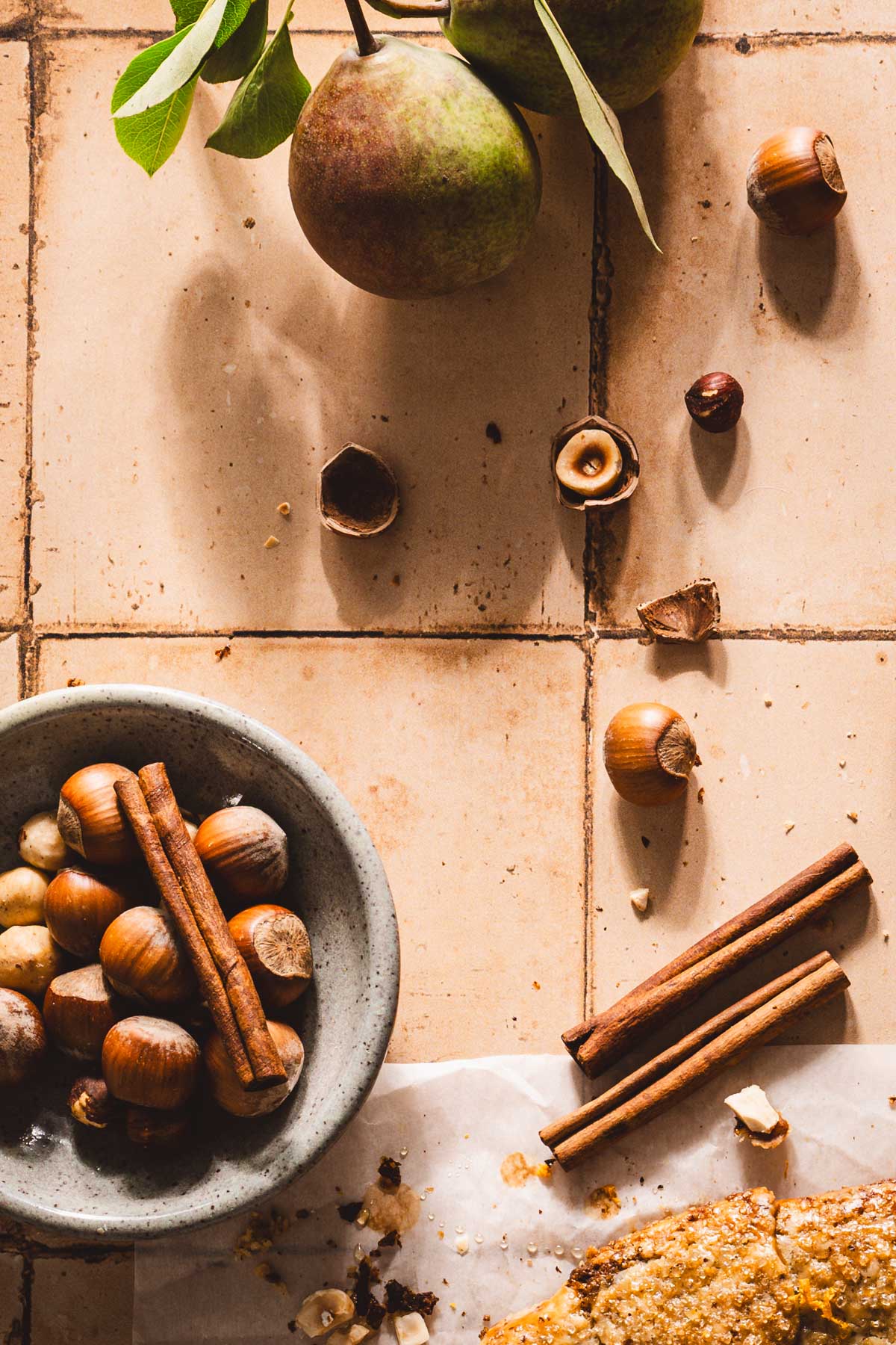 bowl with hazelnuts, fresh pears