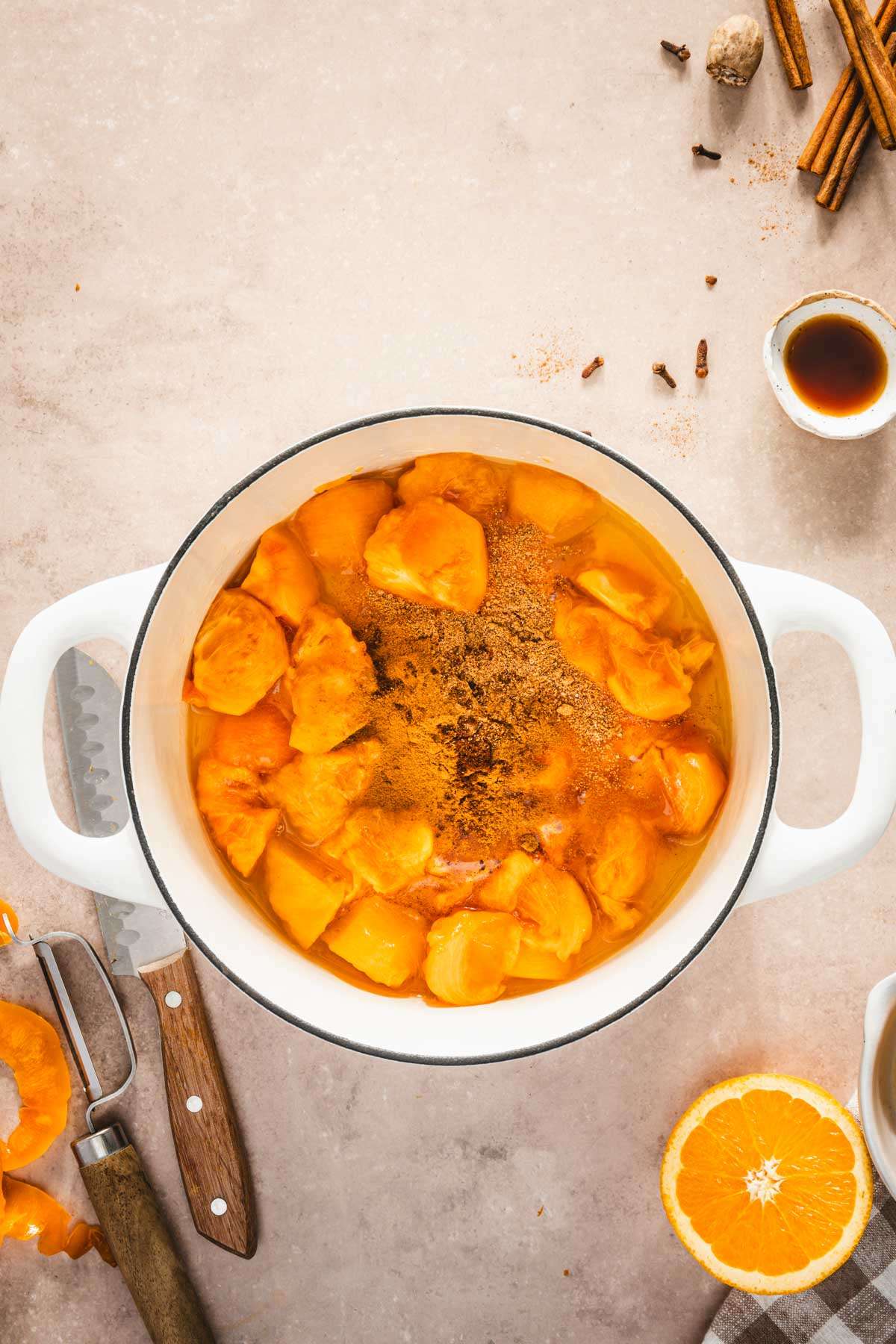 spices added to cut up persimmons in the pan