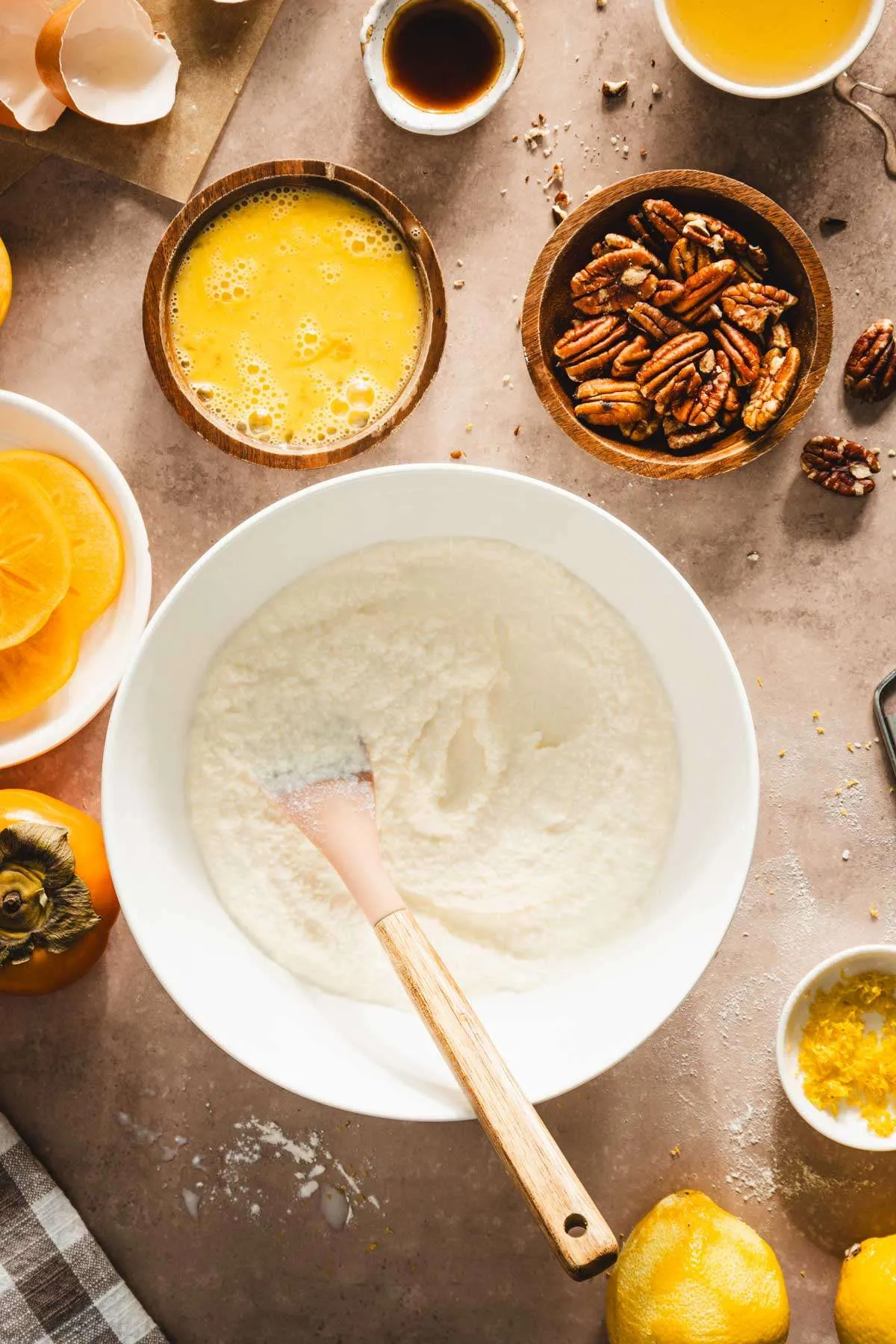 bowl with ricotta cheese, dish with cracked eggs, other ingredients