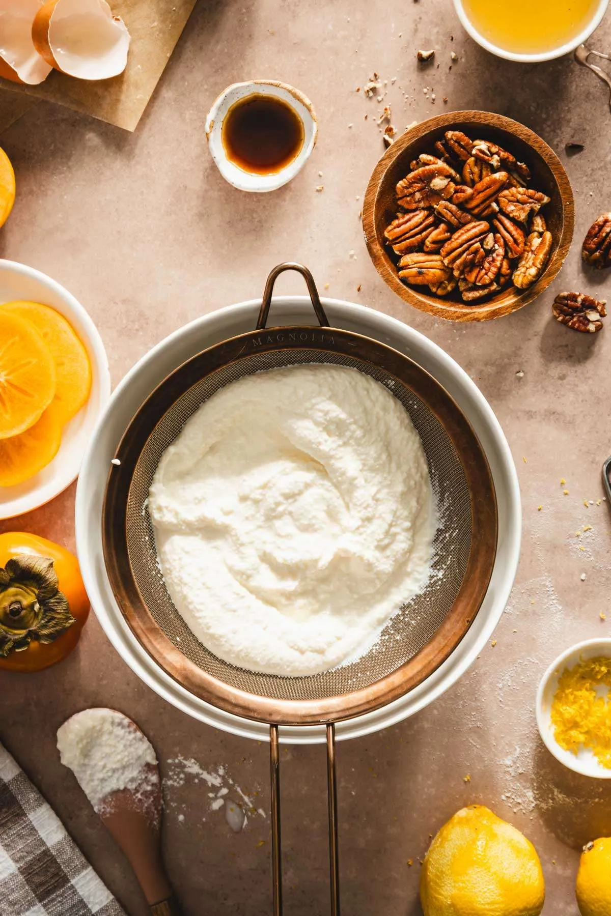 ricotta cheese straining over strainer