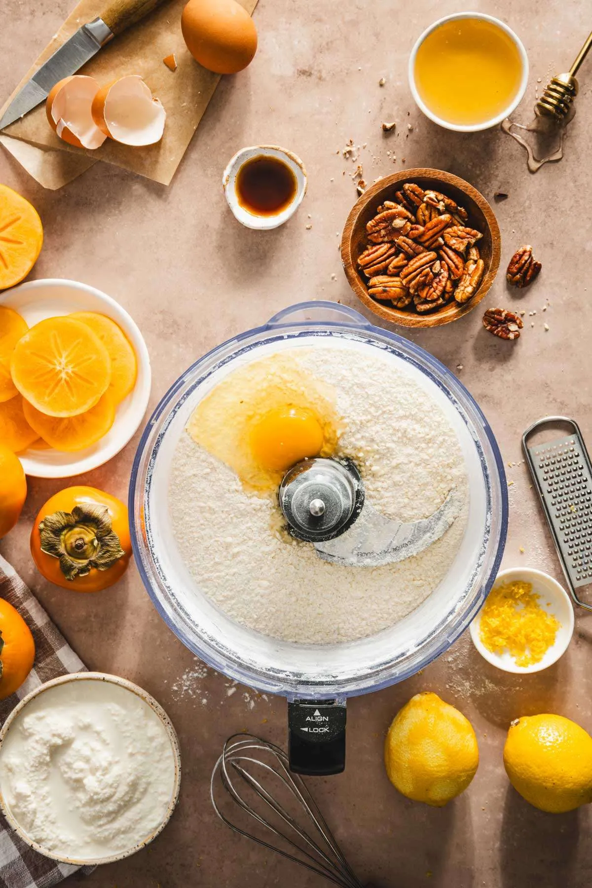 food processor container with dry ingredients and one egg