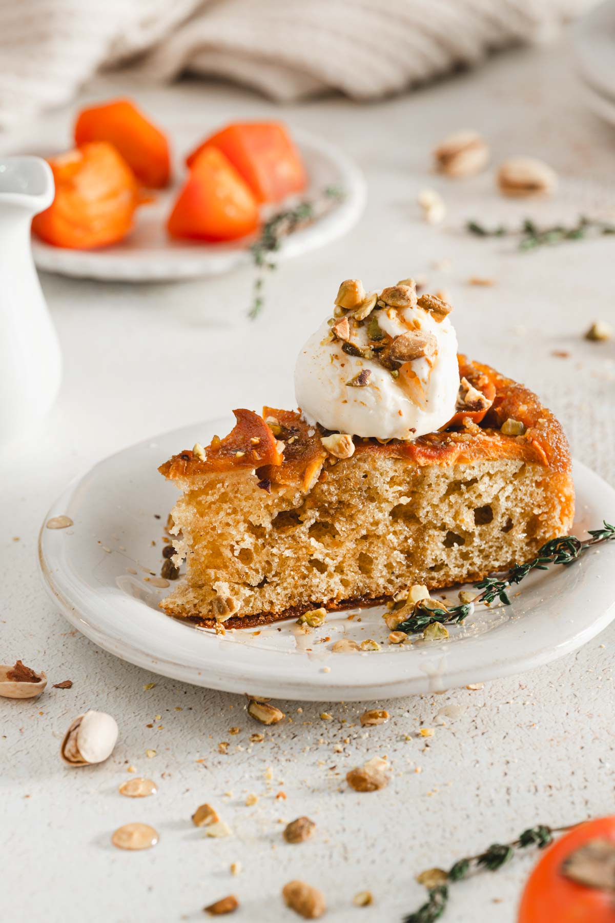 cak wiht a scoop of ice cream with nuts and syrop