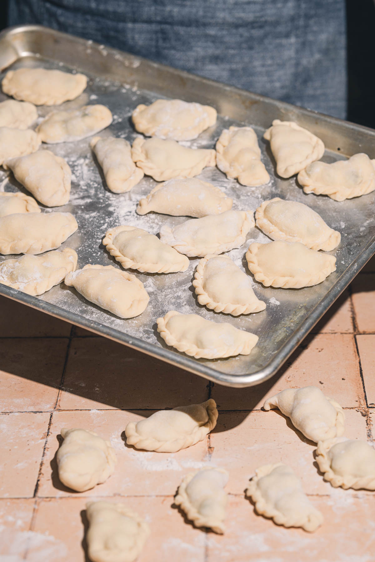 made pierogi on a baking sheet