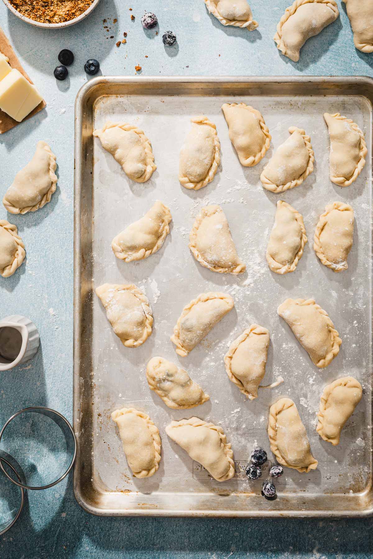 formed pierogi on a baking sheet