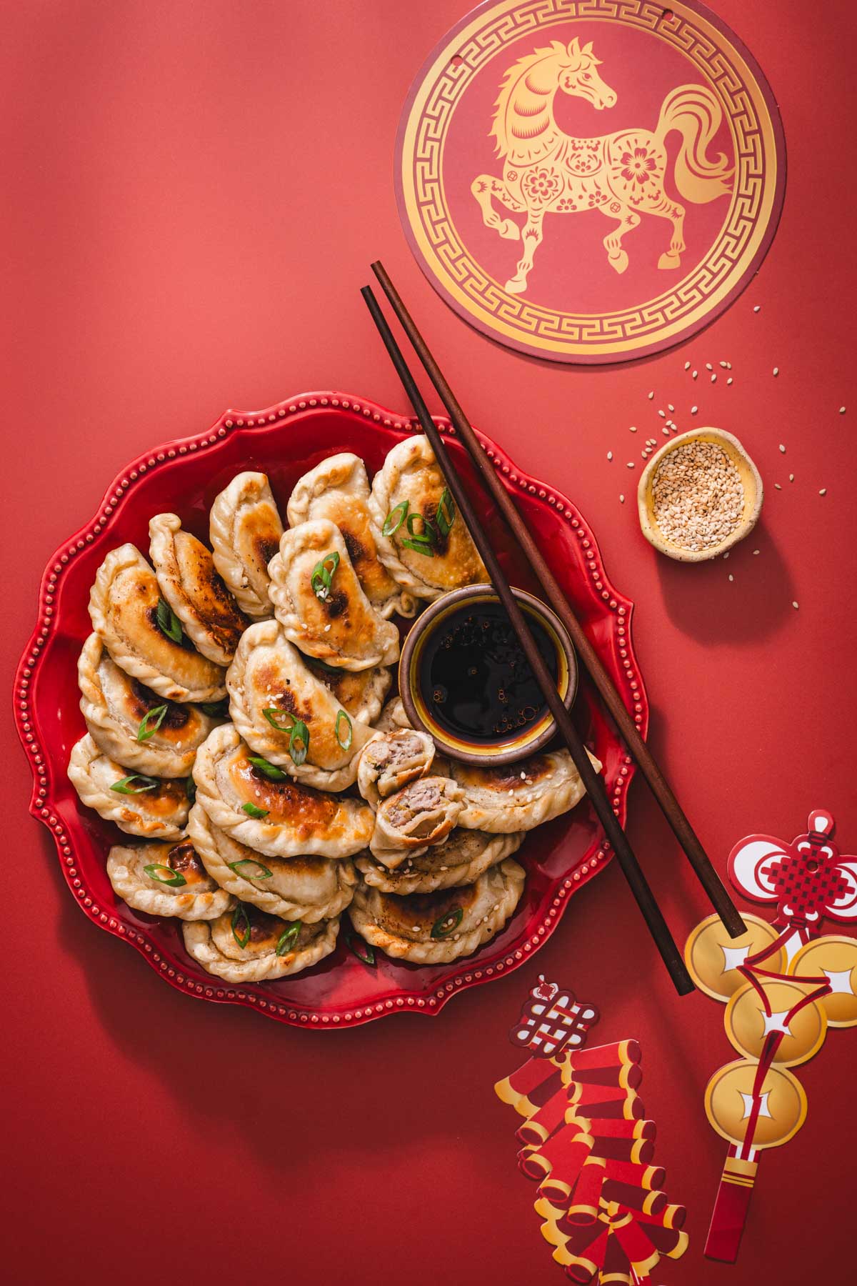 fried pierogi on red plate and red background