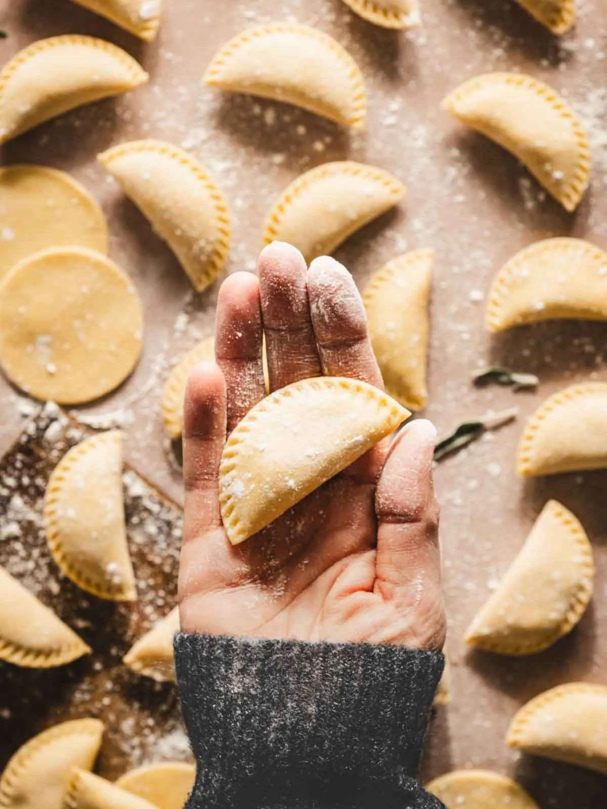 hand holding pierogi