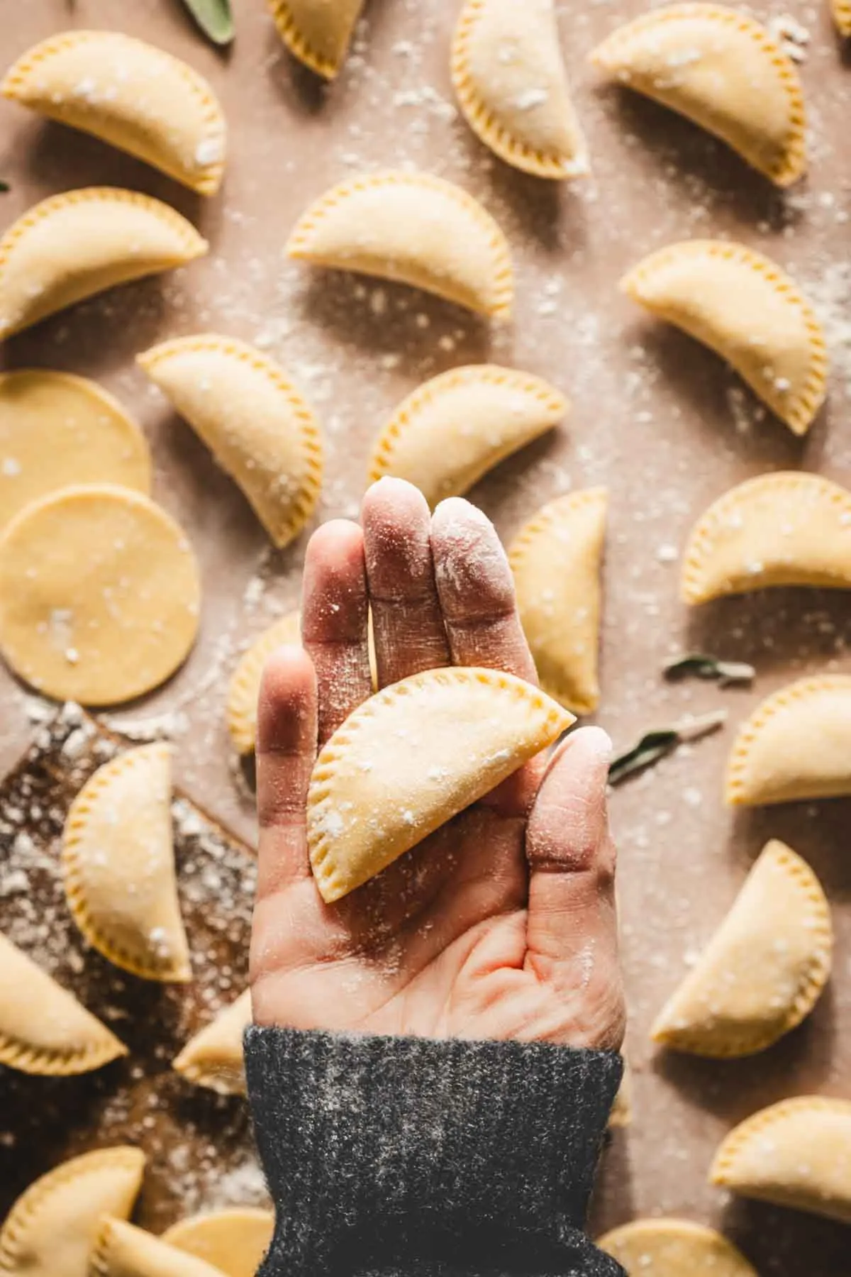 hand holding pierogi