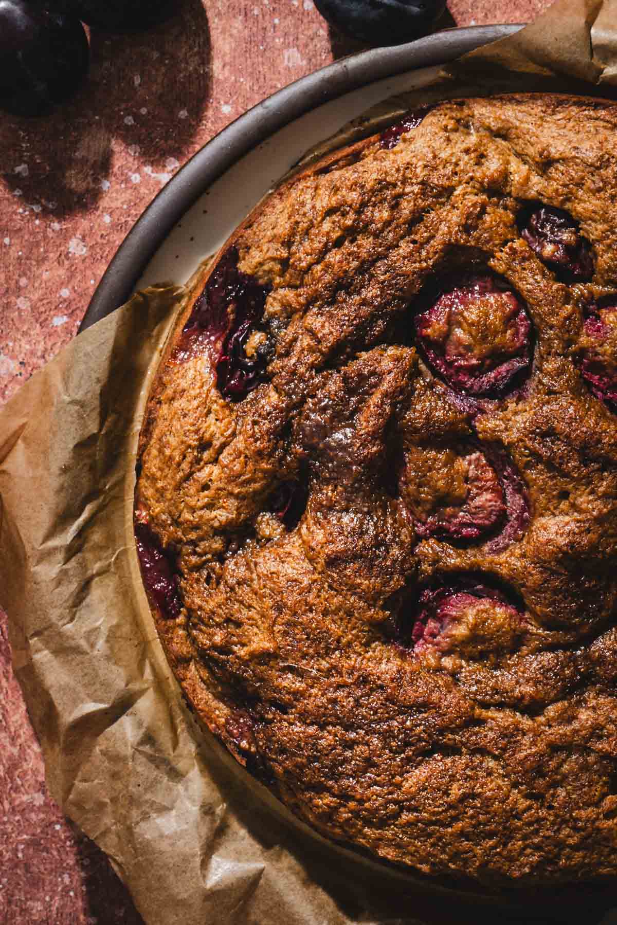 close up of the cake, fresh plums